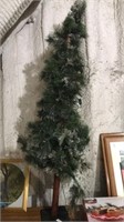 Country primitive lighted pine tree with cones