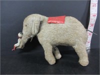 VINTAGE WINDUP ELEPHANT WITH CELLULOID MAN