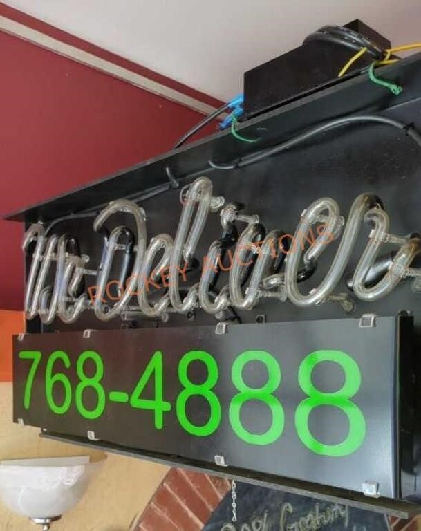 neon we deliver sign