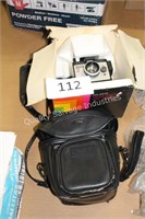 vintage polaroid camera with bag