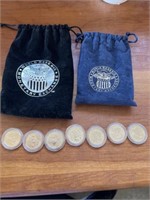 7 presidential dollar coins with two World