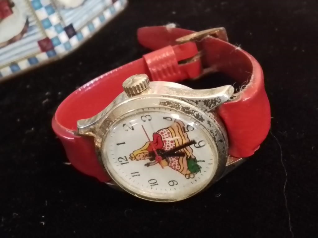 Is child's watch with red leather band