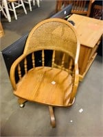 Vintage wooden office chair on wheels