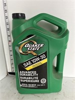 Full jug of Quaker state motor oil