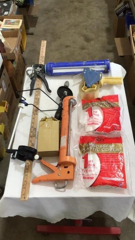 Embossed plastic cover, caulking guns, tape gun,