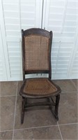 ANTIQUE WOOD AND CANE BACK AND SEAT ROCKING CHAIR