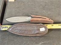 custom Damascus steel knife with walnut handles