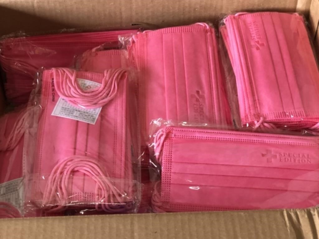 Box Filled with New Sealed Packages of Pink Masks