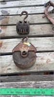 2- vintage pulleys.