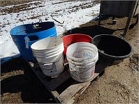 Feed pans and plastic buckets