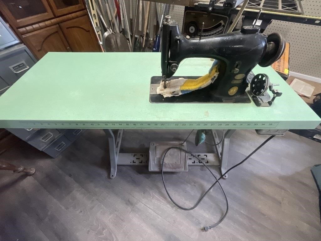 Vintage Singer Sewing Machine on metal table with