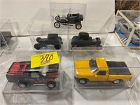 5 CAR MODELS IN PLASTIC CASES