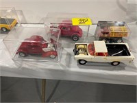 4 CAR MODELS IN PLASTIC CASES