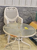 ROUND GLASS TABLE AND (4) PLASTIC CHAIRS