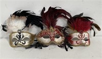 3 leather masks - one marked Made in Italy"