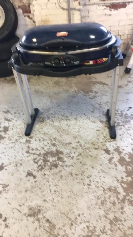 Propane grill on stand and cooler