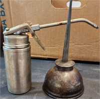 Two antique oil cans