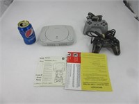 Console Playstation avec manette et tapis