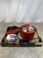 Assortment of tin platters and jars with lids