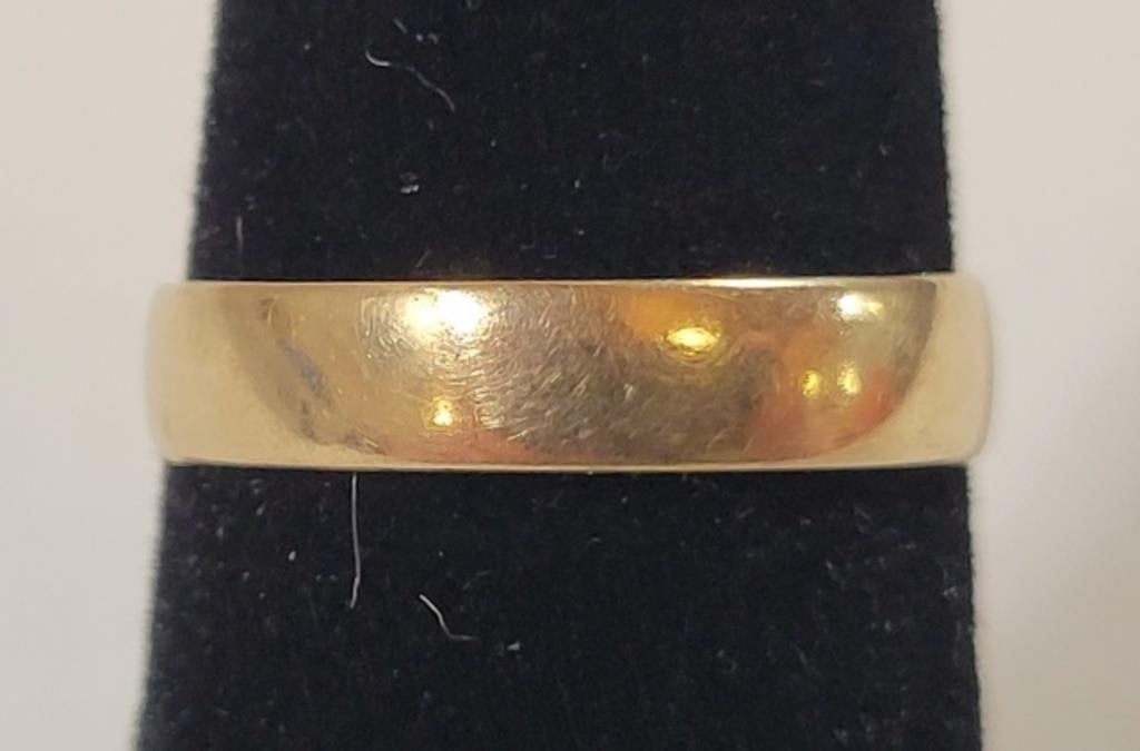 Gold Wedding Band, marked "18", has inscription