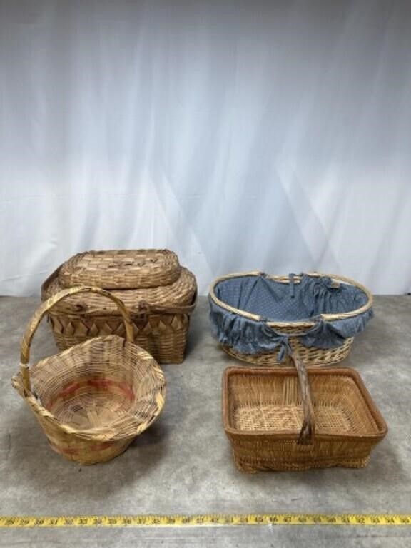 Picnic basket and assortment of wicker baskets