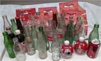 Plusieurs bouteilles et carton de coke