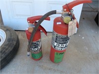 Two Fire Extinguishers, one in green