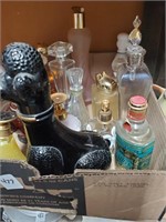 Box of perfume  bottles with some contents