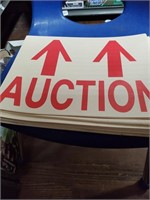 Lot of auction signs and Wicker Basket of books