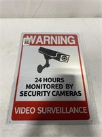 WARNING 24 HOUR MONITORED BY SECURITY CAMERAS