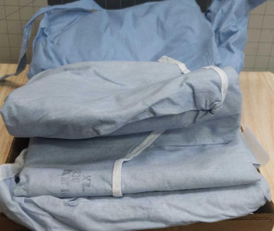 Lot of hospital gowns/paper material ( 4 )
