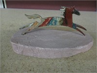 Vintage Metal Horse sculptue on rock