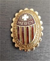 Marked 10K Mercy School of Nursing Pin.