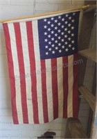 US flag on  2-piece pole. 24×34. Needs cleaning.