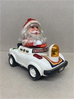 Battery operated Santa Claus in a car