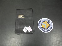 police notebook and patch