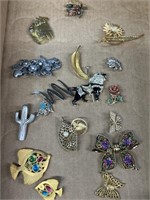 Broaches and pins