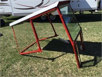 Tractor cab frame with front windshield