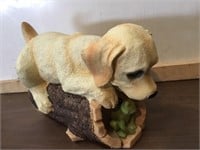 Bobble head dog on a log
