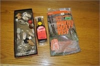new hunter safety vest, deer scent, shells, rocks