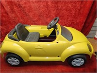 VW Volkswagen Beetle yellow pedal car.