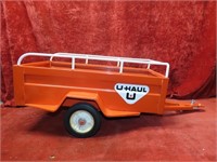 Vintage pressed steel U-Haul trailer.