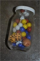 small jar of marbles and wooden dice
