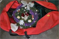 bag of Christmas tree limbs, tree skirts, wreath