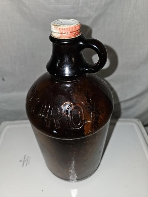 Brown clorox bottle with lid