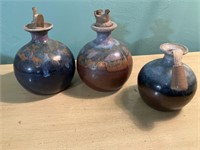 Three oil lamp pottery pieces