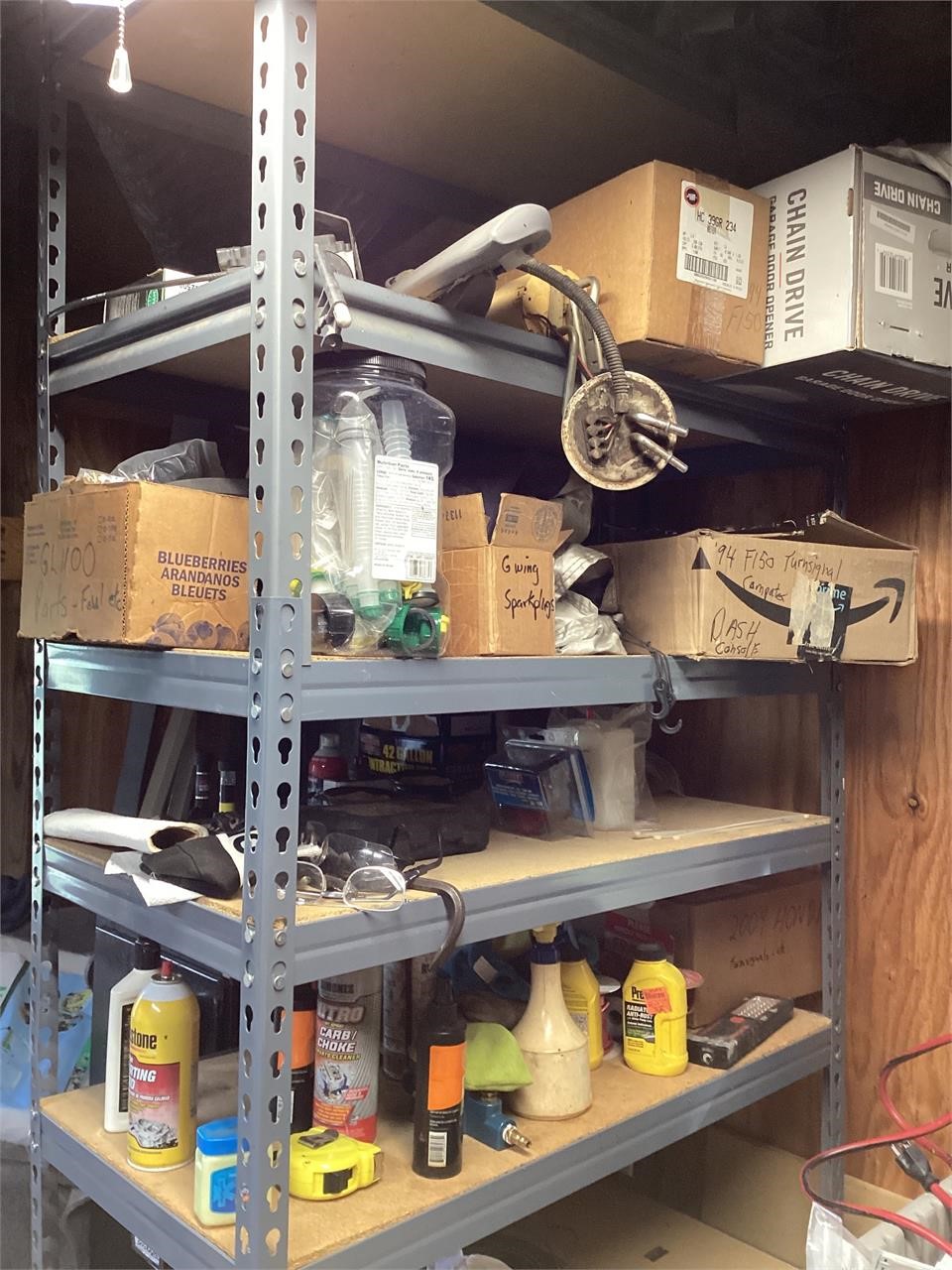 Gray metal shelving unit with contents