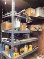 Gray metal shelving unit with contents