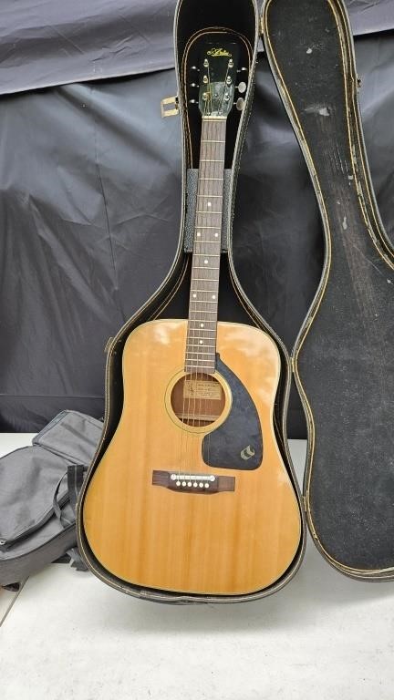 Aria guitar and case