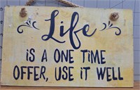 Wooden sign "life is a one time offer, use it